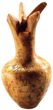 Thumbsized ivory pomegranate bearing a paleo-Hebrew inscription, probably from the First Temple in Jerusalem