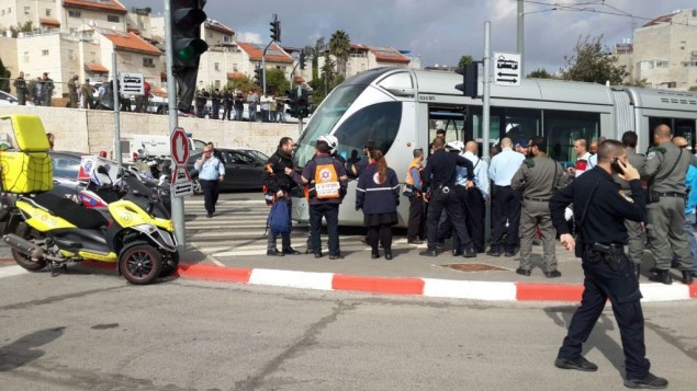 Police and paramedics arrive at the scene of stabbing attack in Pisgat Zeev