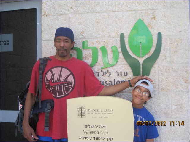 Volunteer Curtis Sparks brought along his eight-year-old son, Tacoma, on this year’s trip to Israel