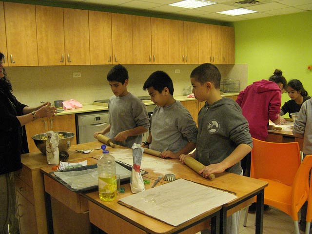 Baking and cooking are among activities shared by regular and autistic students