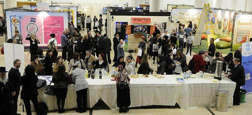 Parents at the conference peruse products for people with disabilities