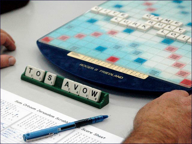 Club director Roger Friedland uses a personalized board