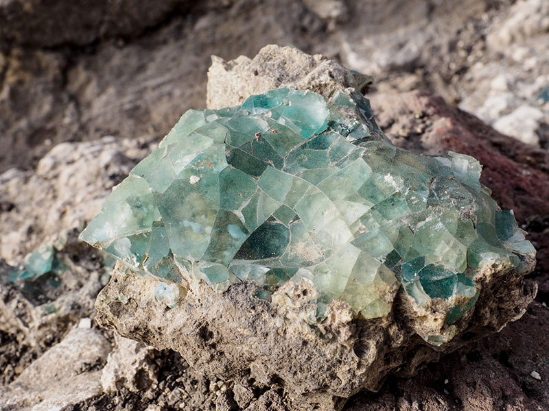 Small fragments of the raw glass as they were found at the site