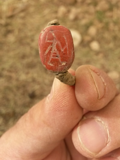 Ring inlaid with a seal depicting an Egyptian warrior holding a shield and sword