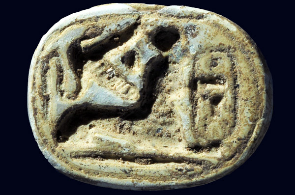 A scarab seal of the Egyptian pharaoh Thutmose III with a sphinx crouching near the pharaoh’s name