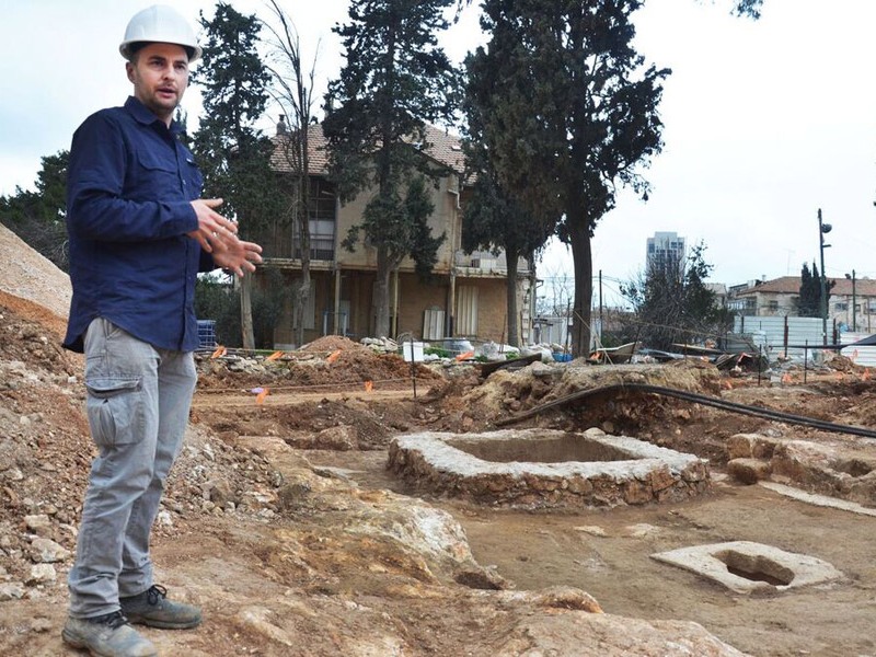 Alex Wiegmann, excavation director, views winepress uncovered in Schneller Compound