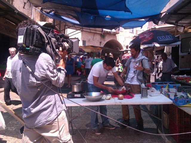 Preparing a dish in the market with chef Elias Mattar