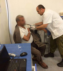 Palestinian receiving treatment at Israeli field hospital at Erez Crossing