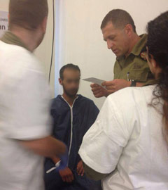 Palestinian receiving treatment at Israeli field hospital at Erez Crossing