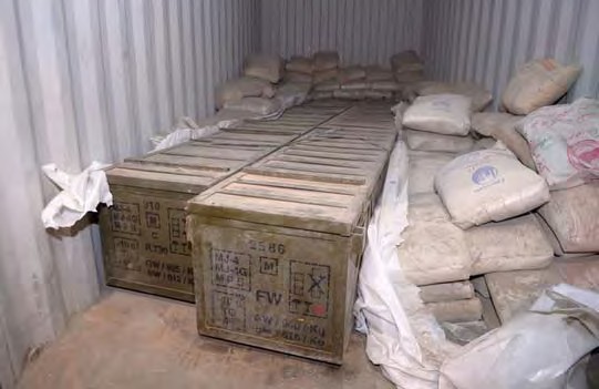 Crates of weapons concealed under bags of cement