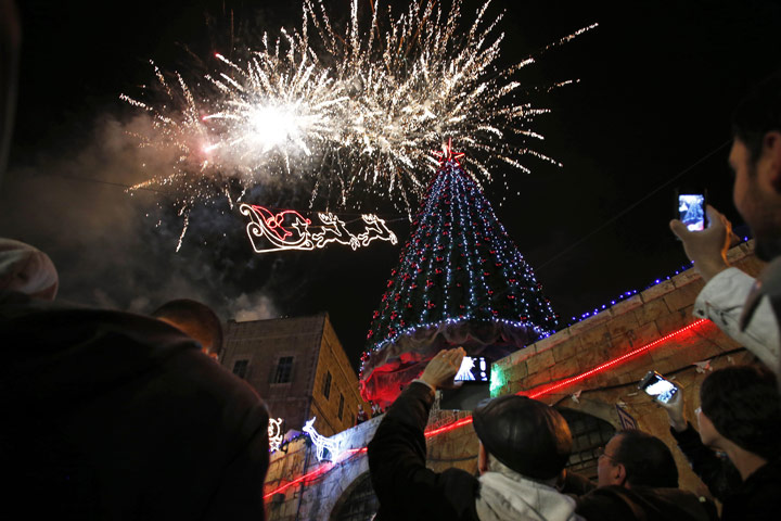 Fireworks explode during a Christmas tree lighting ceremony in Jerusalem's Old City