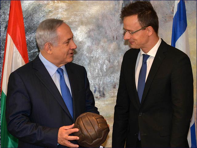 PM Netanyahu receives soccer ball autographed by noted Hungarian soccer player Ferenc Puskas from Hungarian Foreign Affairs and Trade Minister Szijjarto