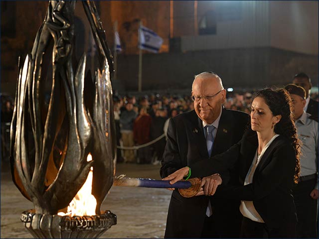 President Rivlin kindling the memorial flame with widow of soldier who fell in Operation Protective Edge