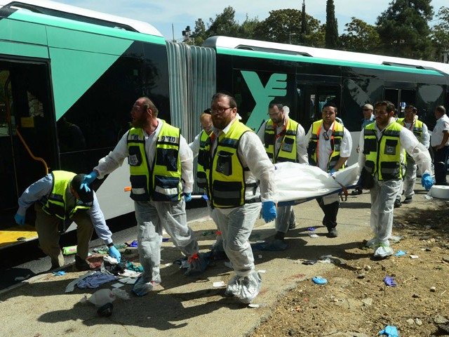 Body of victim removed from scene of terror attack on bus in Jerusalem