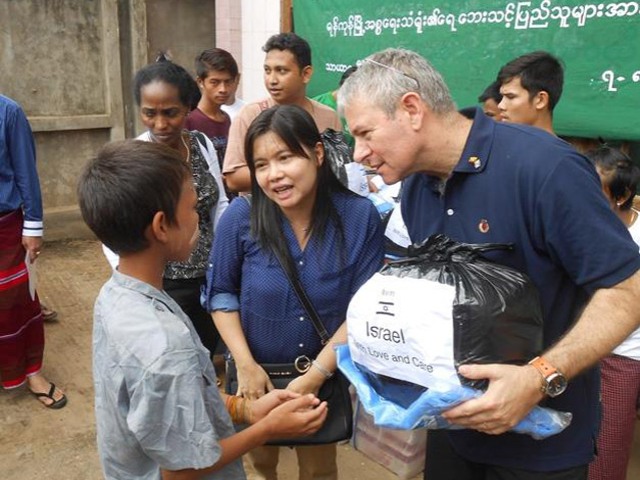 Ambassador Zonshine with flood victims in Myanmar