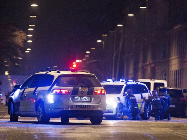 Police personnel and vehicles following shooting at a synagogue in central Copenhagen