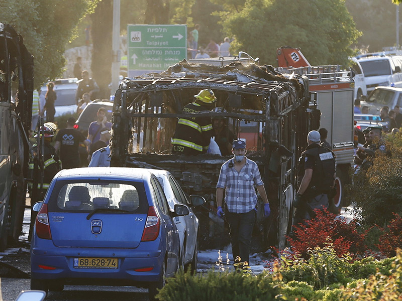 Emergency workers at the scene of the terrorist attack on the bus in Jerusalem