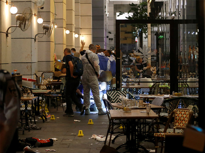 Israeli policemen at  a restaurant in Sarona in the aftermath of the terror attack