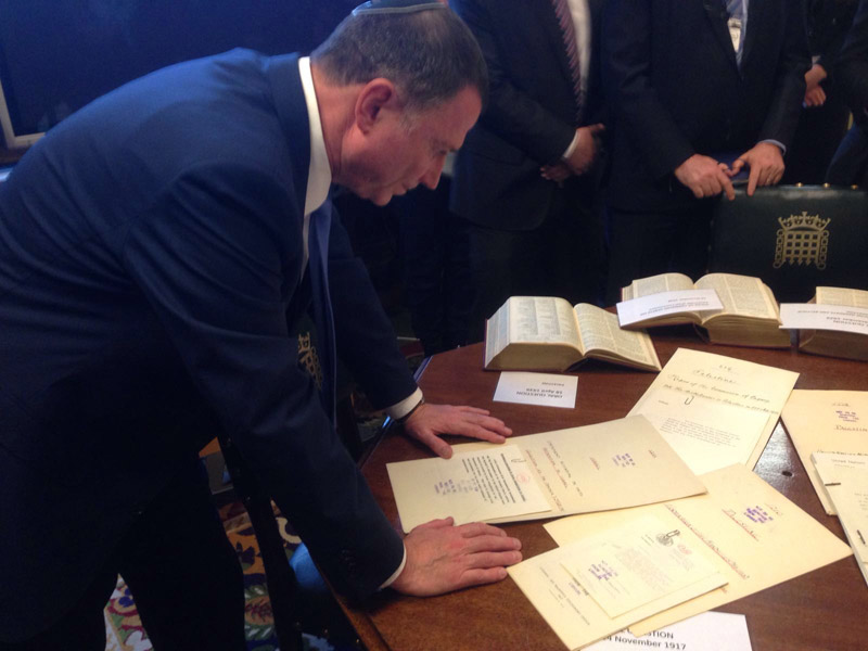 Edelstein at UK Parliament library examining documents declaring end of British Mandate and recognition of Israel