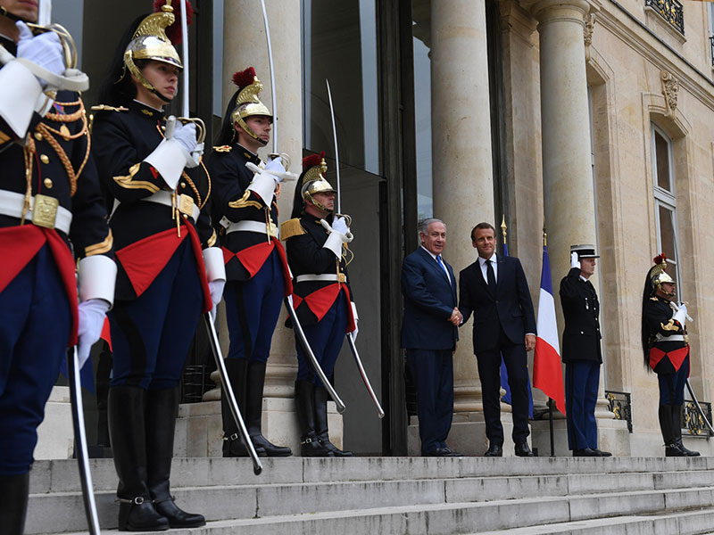 PM Netanyahu is welcomed at the Elysee Palace by French President Emmanuel Macron