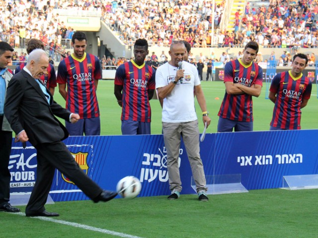 President Peres kicks off to open special practice games of Barca in Israel