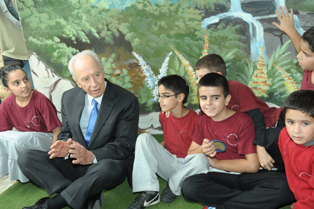 President Peres with children in a school bomb shelter in Sderot