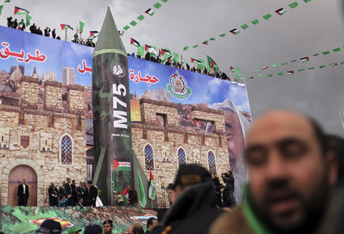 Model of the M75 missile during a rally marking the 25th anniversary of the founding of Hamas, in Gaza City