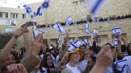 Israelis wave flags during reenactment of the celebrations of Nov 29, 1947