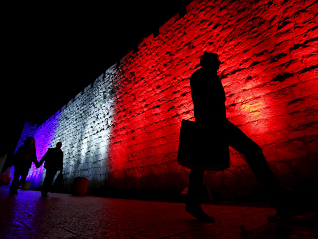 Jerusalem's Old City walls lit up in the colors of the French flag, in solidarity with Paris