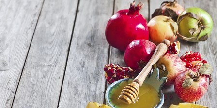 Pomegranate, apples and honey background