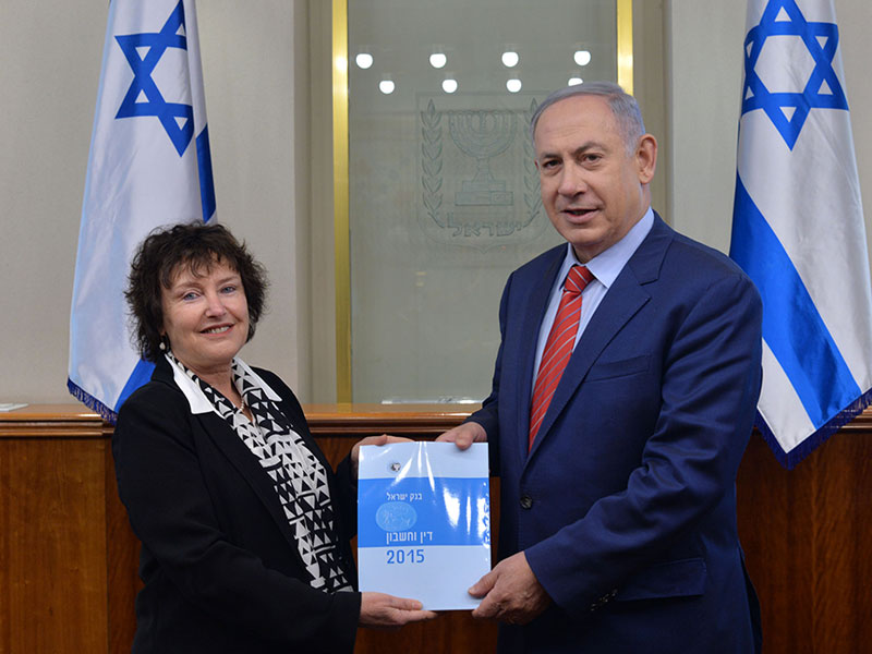 PM Netanyahu receiving Bank of Israel annual report from BOI Gov. Dr. Karnit Flug