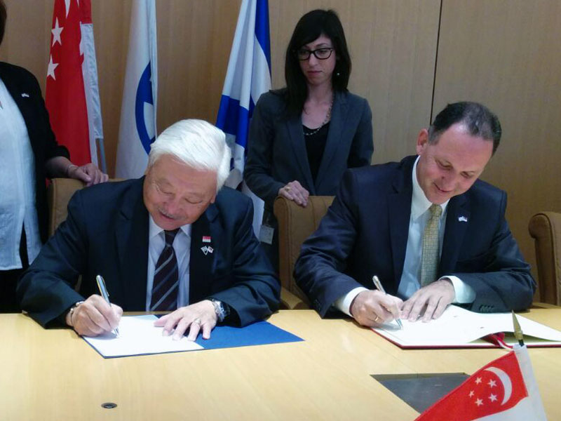 Ambassadors Winston Choo Wee Leong and Gil Haskel at the signing ceremony