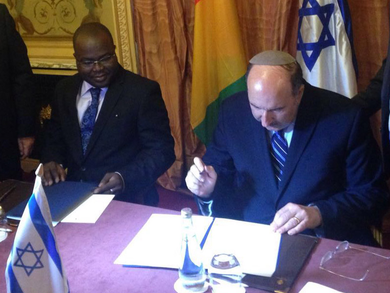 Dir-Gen Dore Gold and Ibrahim Khalil Kaba at the signing ceremony