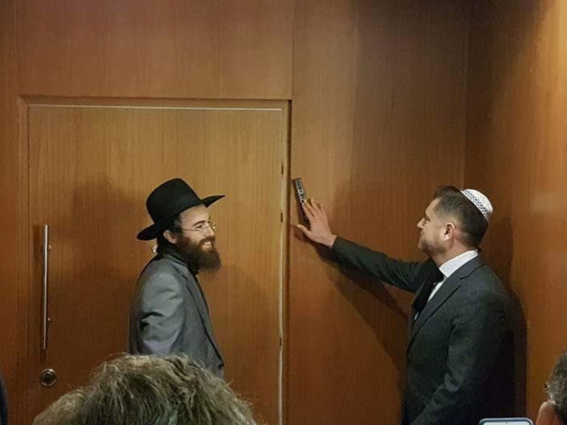 Mounting the mezuzah at the embassy