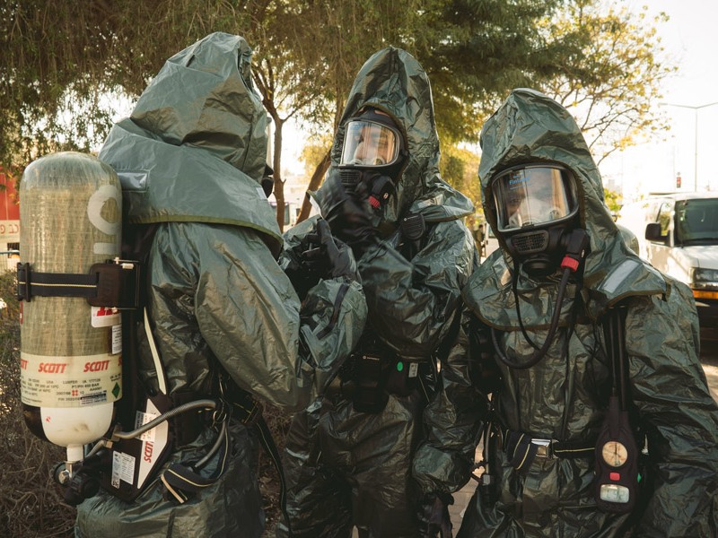 Emergency responders prepare to enter the site of the toxicological drill