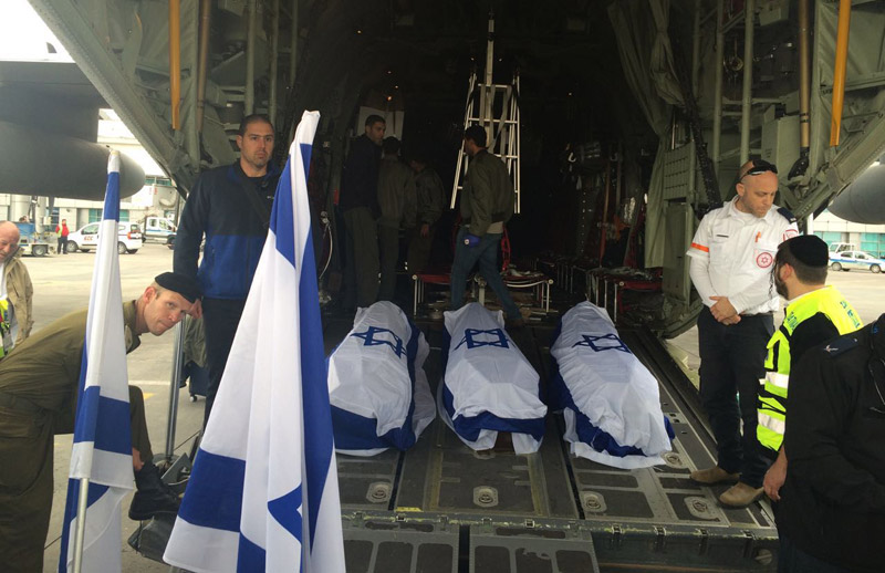 Coffins draped in the Israeli flag being loaded onto the plane at Istanbul airport to return to Israel