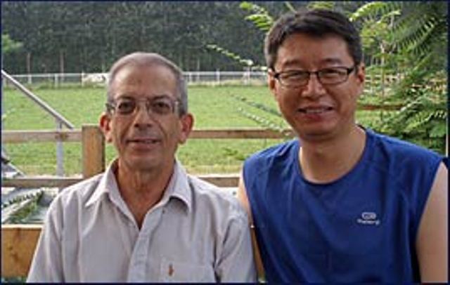 AfiMilk’s Pinhas Gur, left with Charles Zhou, general manager for AfiMilk China