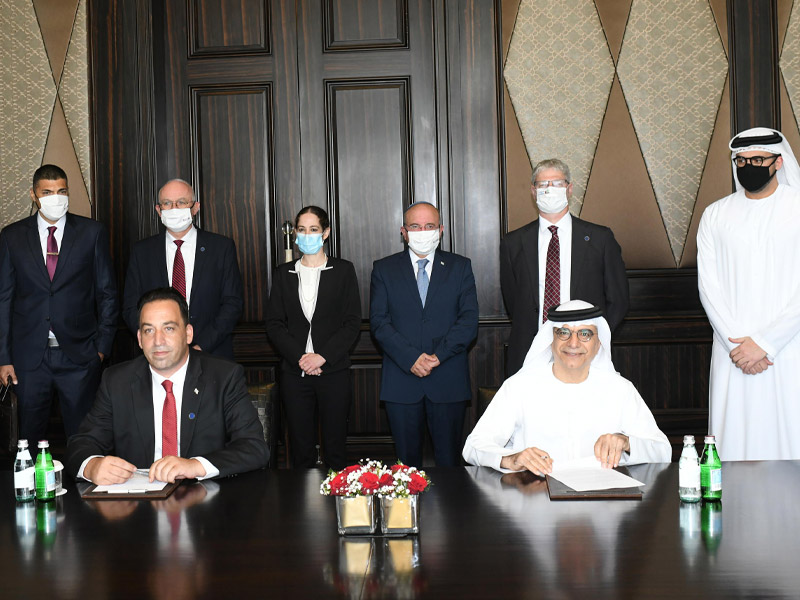 PMO Acting Director General Ronen Peretz (seated, left) and United Arab Emirates Central Bank Governor Abdulhamid Saeed (seated, right) at the signing ceremony.