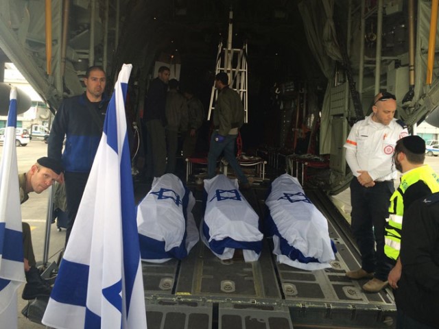 Coffins draped in the Israeli flag being loaded onto the plane at Istanbul airport to return to Israel