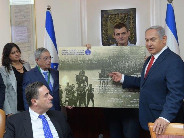 PM Netanyahu receiving a new addition of Jabotinsky's writings at the weekly Cabinet meeting.