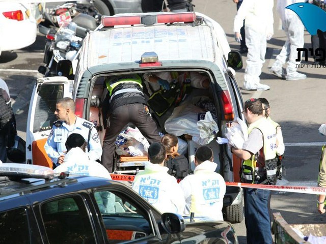 Zaka volunteers evacuating bodies of victims killed in Jerusalem synagogue terror attack