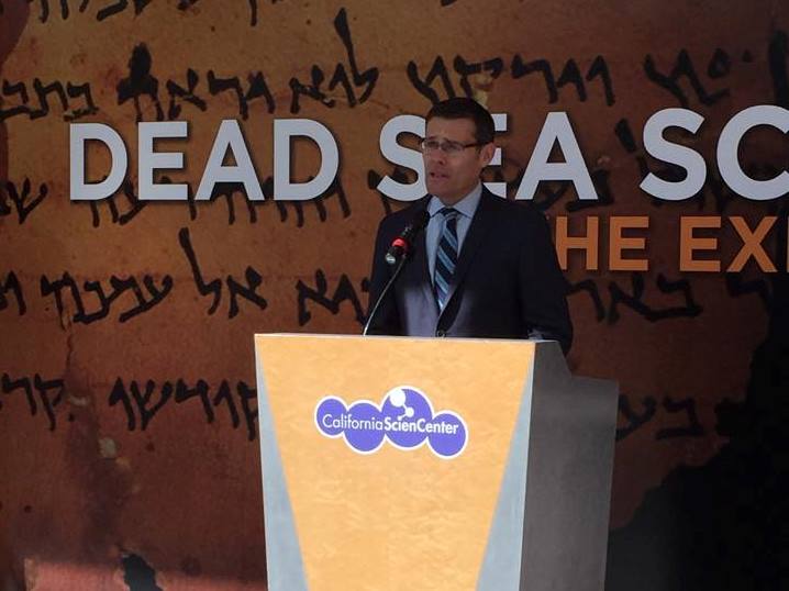 Consul General of Israel, David Siegel viewing the Dead Sea Scrolls during the media preview day at the California Science Center.