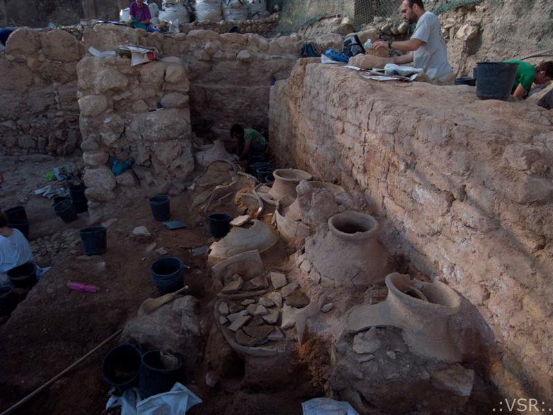 Pithoi of Hazor's Area M near a mudbrick wall. View facing South