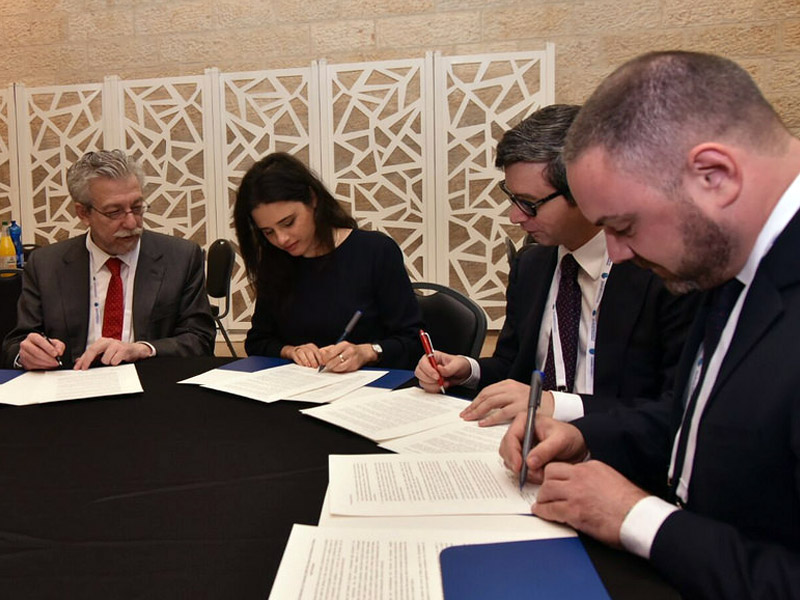 The justice ministers at the signing ceremony.