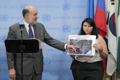 Amb. Prosor shows a map of a rocket launcher in vicinity of schools in Gaza