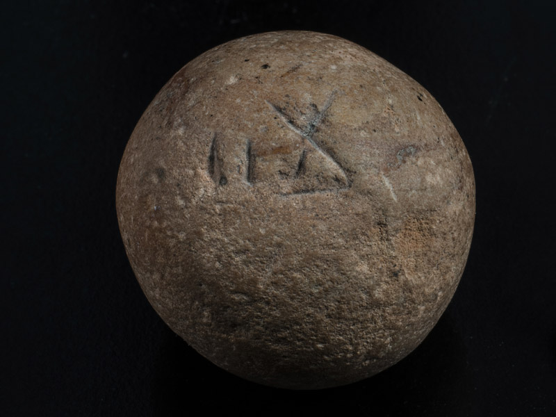 The ancient two-shekalim weight discovered in Jerusalem.